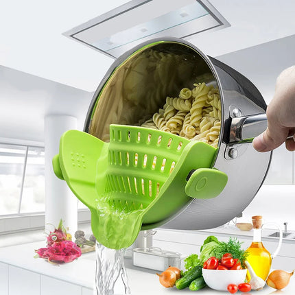 Universal Silicone Strainer Clip attached to pot draining pasta or vegetables