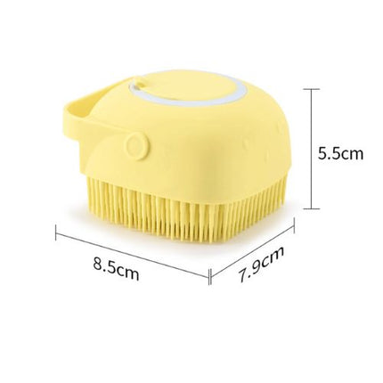 Pet bath brush shampoo dispenser close-up showing silicone bristles and button