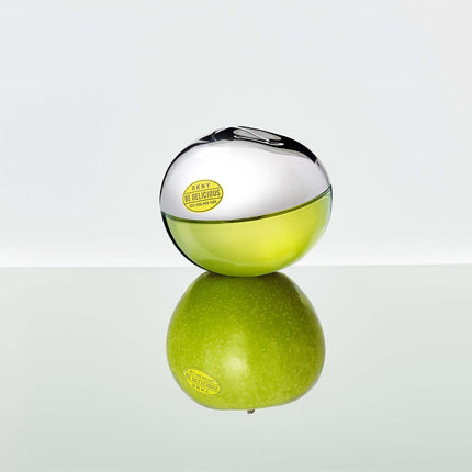 DKNY Be Delicious by Donna Karan for Women - 4 Pc Gift Set 3.4oz EDP Spray, 0.5oz EDP Spray, 3.4oz Body Lotion, Pouch