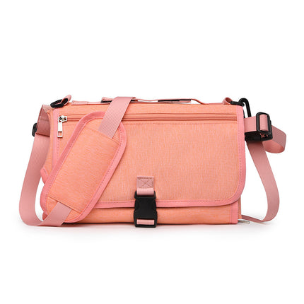 Portable baby changing pad with safety strap and cushioned padding for newborns