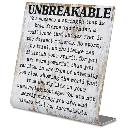 Letrero de escritorio inspiracional irrompible con cita de resiliencia y fuerza