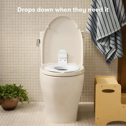 Frida Baby Drop Down Potty Seat, Potty Training Seat for Toddlers, Attaches Securely to Adult Toilet, Flips Up or Stays Down for Kid Ready Access, Easy to Clean, Secure, Stable & Easy to Install