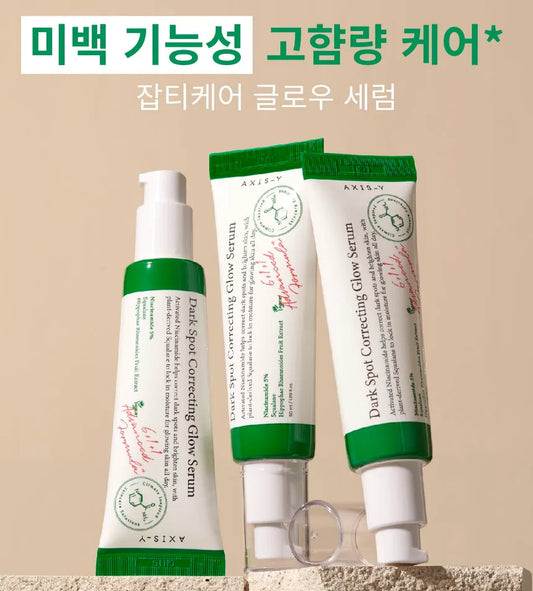 AXIS-Y Dark Spot Correcting Glow Serum bottle with dropper on clean background